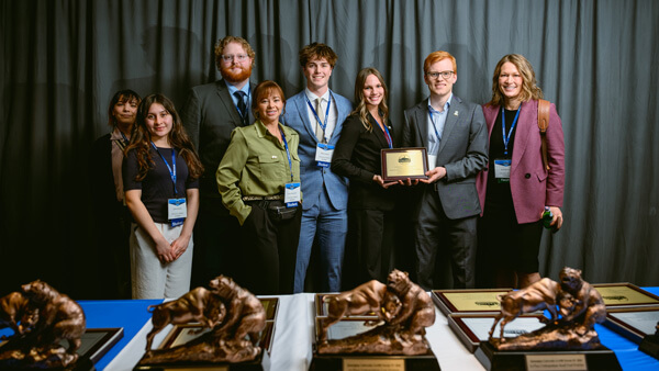 Undergraduate Growth category awardees gather for a group photo on stage at the Forum Poster Competition Awards Ceremony.
