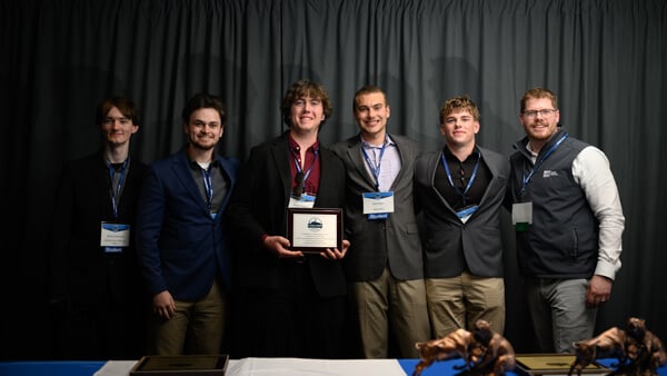 Undergraduate Small Fund category awardees pose for a group photo on stage during the Forum Poster Competition Awards Ceremony.