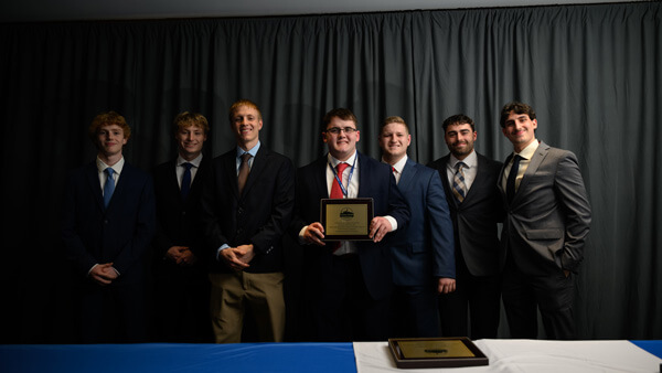 Undergraduate Small Fund category awardees pose for a group photo on stage during the Forum Poster Competition Awards Ceremony.