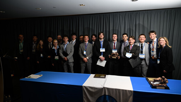 Undergraduate Small Fund category awardees pose for a group photo on stage during the Forum Poster Competition Awards Ceremony.