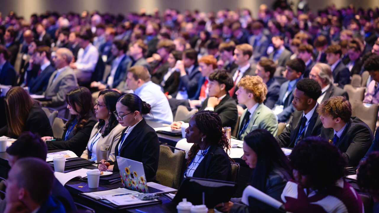 A crowd of students seated in the audience during the Forum.