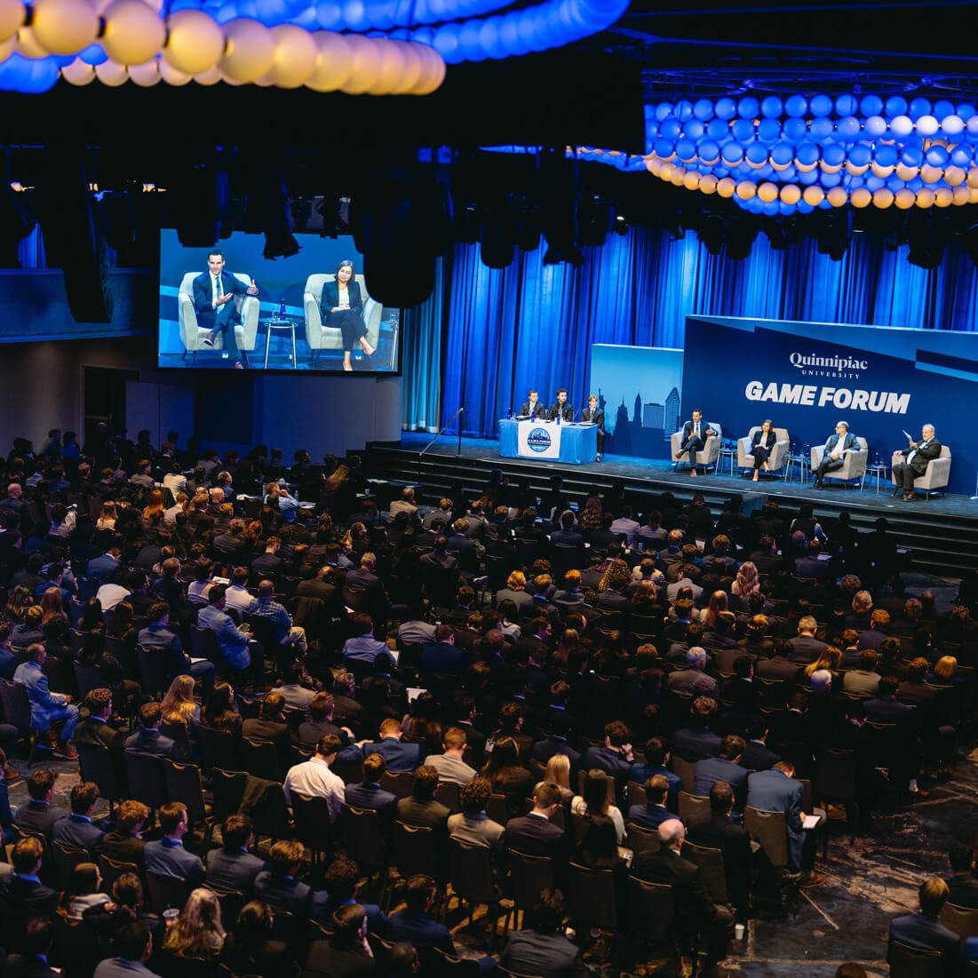 Panelists speak to a crowd of students at the 2025 GAME Forum.