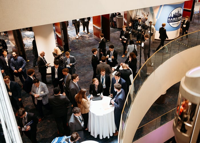 An aerial view of students walking through a career networking expo during the forum.