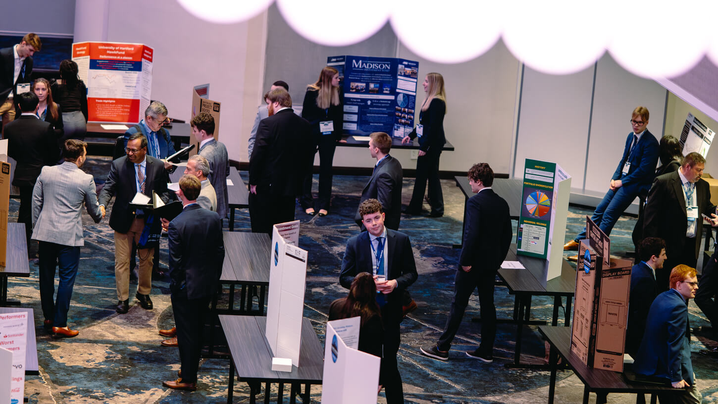 GAME Forum 2025 attendees explore portfolio poster presentations from participating universities.