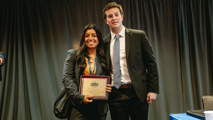 Student participants in the Graduate Overall category gather on stage with their award at the GAME Forum Awards Ceremony.