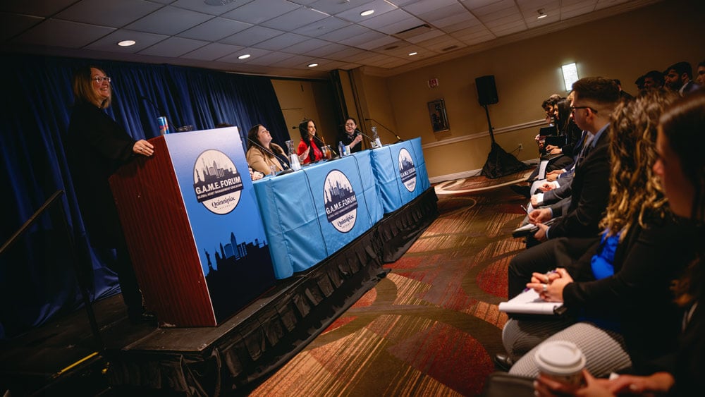 Event attendees listen to a presentation at the GAME Forum.